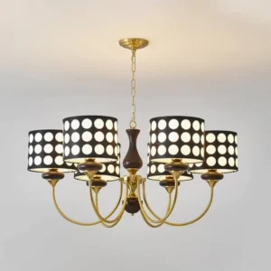 6-light black polka dot chandelier with gold metal arms and dark wood center detail, overhead ceiling view