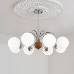 8-arm chrome chandelier installed on ceiling with decorative rose - overhead view