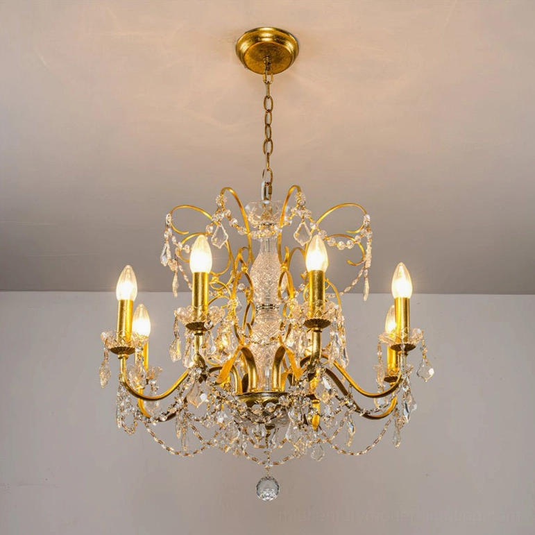 Illuminated 8-head Fauna crystal chandelier with gold finish mounted on ceiling, showing warm light refraction through premium crystals