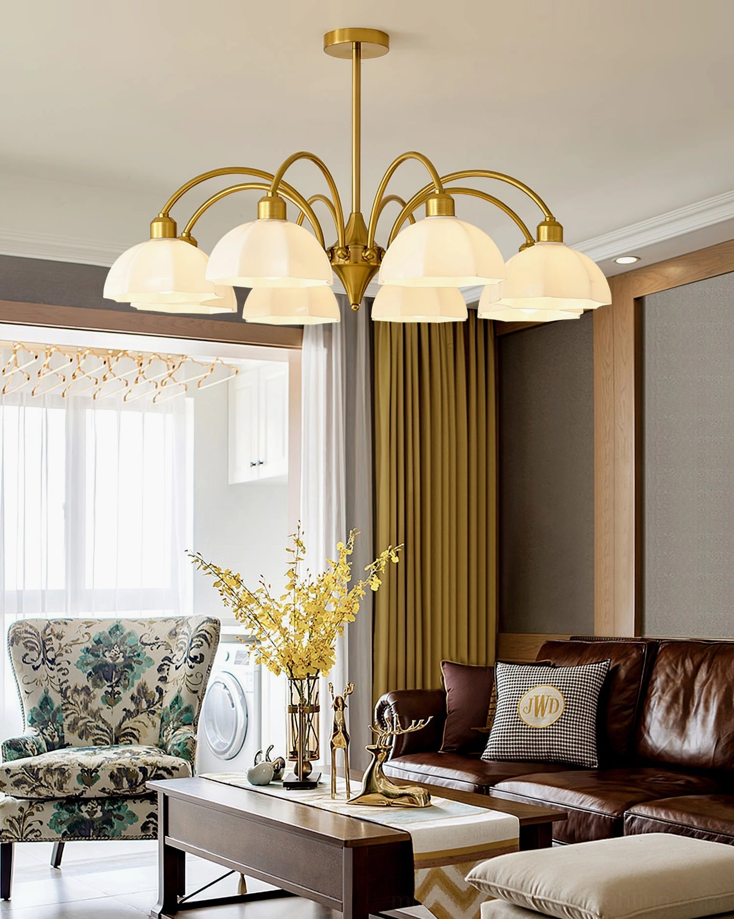 8-head frosted glass bell chandelier with brass gold finish in classic living room with leather sofa, vintage luxury style ceiling light