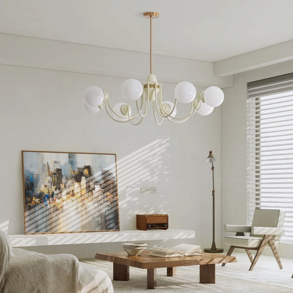 Eight-head globe chandelier illuminated in sunlit modern living room with minimalist furniture