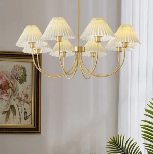 8-head pleated shade chandelier installed in modern living room corner with floral wall art and mid-century decor