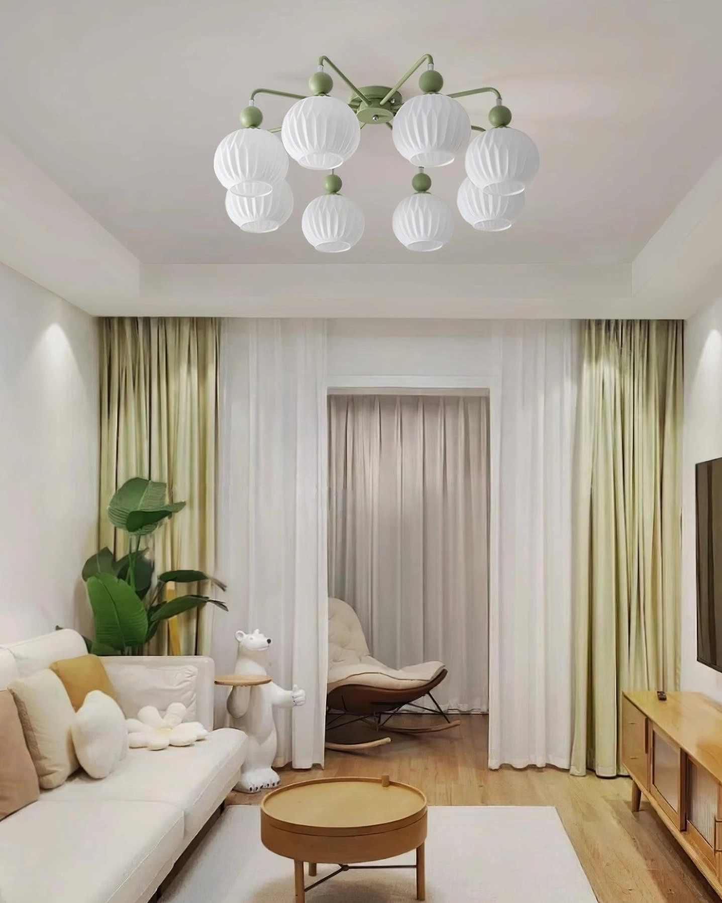 8-light sage green mid-century chandelier in bright nordic living room, overhead installation view