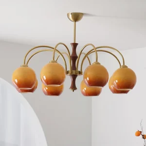 8-head vintage satellite ball chandelier illuminated with warm amber gradient glass shades in minimalist Nordic interior corner with arched decor