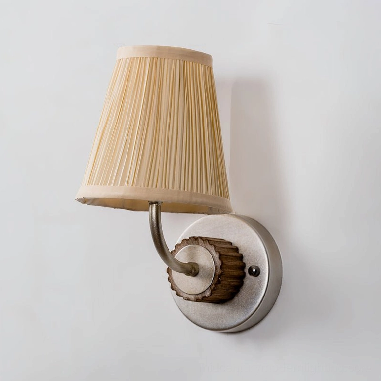 Abbey sconce silver finish variant with beige pleated shade against neutral background