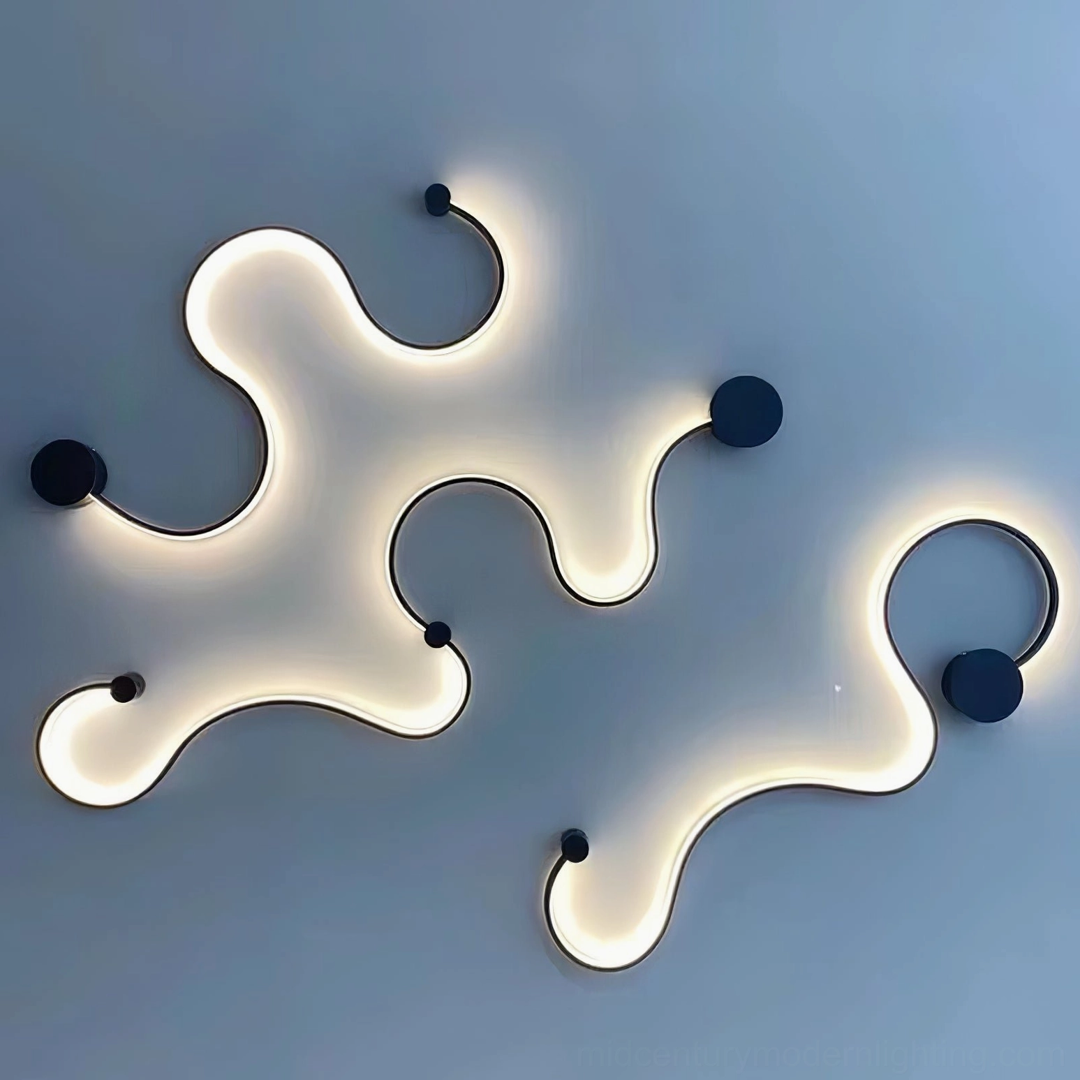 Irregular fluid abstract snake wall lamp creating artistic lighting on blue accent wall