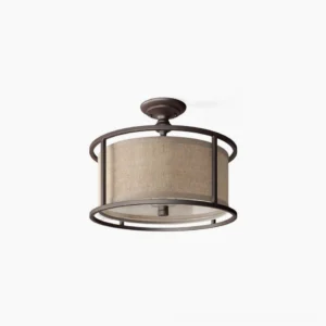 Addyson semi-flush ceiling lamp with antique brass frame and beige fabric drum shade, front view on white background showing transitional modern lighting fixture