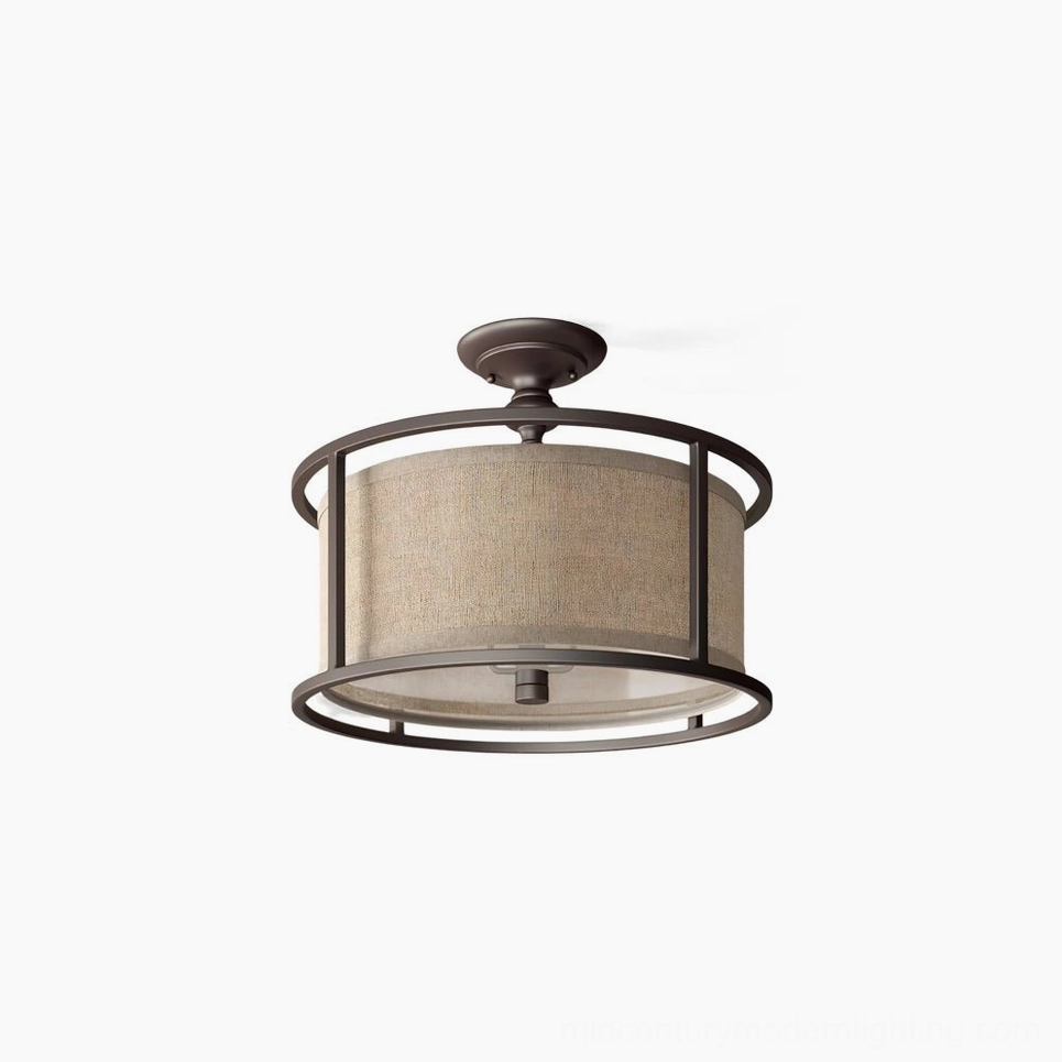 Addyson semi-flush ceiling lamp with antique brass frame and beige fabric drum shade, front view on white background showing transitional modern lighting fixture