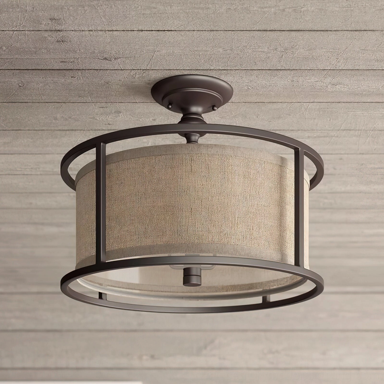 Three-quarter side view of Addyson ceiling lamp showing double-layer shade structure and industrial brass metalwork detail on wooden ceiling mount