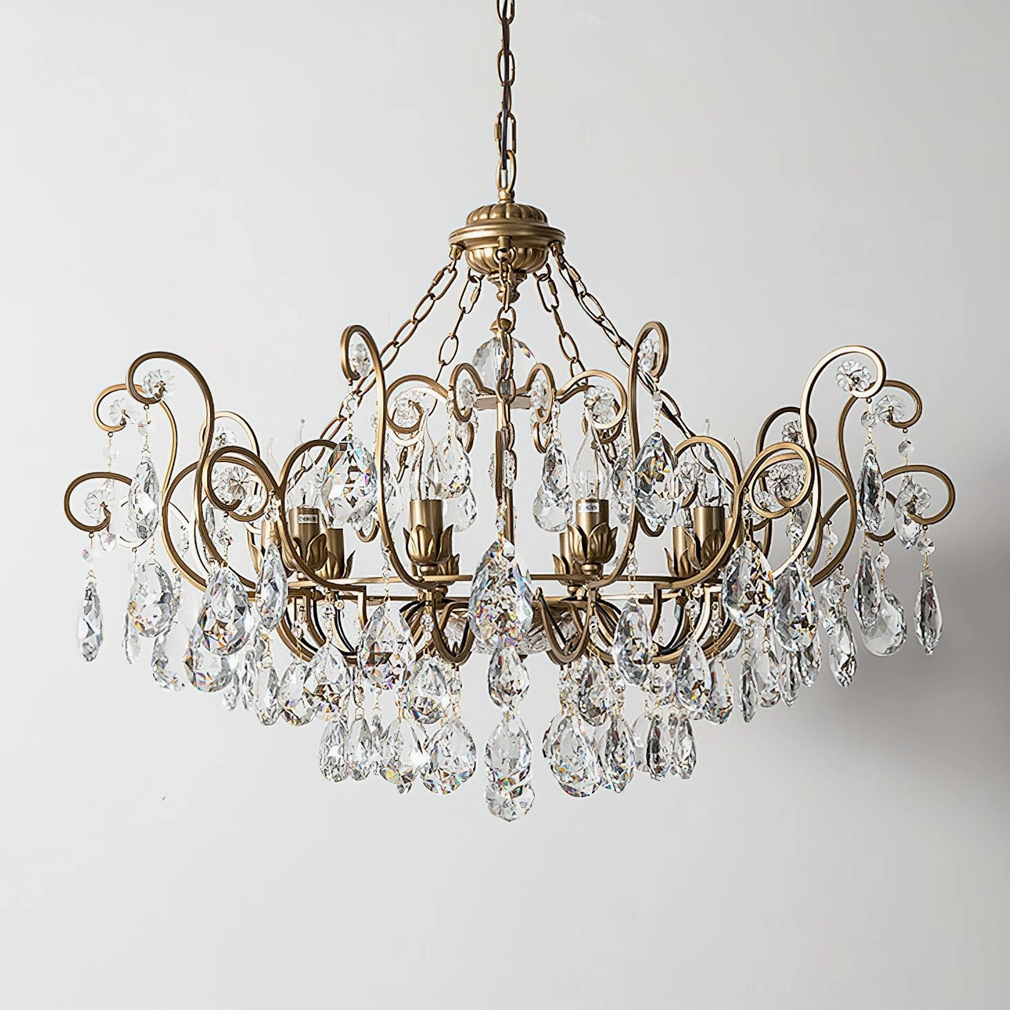 Side overhead perspective of Aeliana Crystal Chandelier highlighting large scrollwork design and abundant hanging crystals in warm gold tone