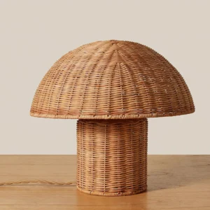 Aero rattan mushroom lamp three-quarter angle showcasing hand-woven rattan details and gold metal frame