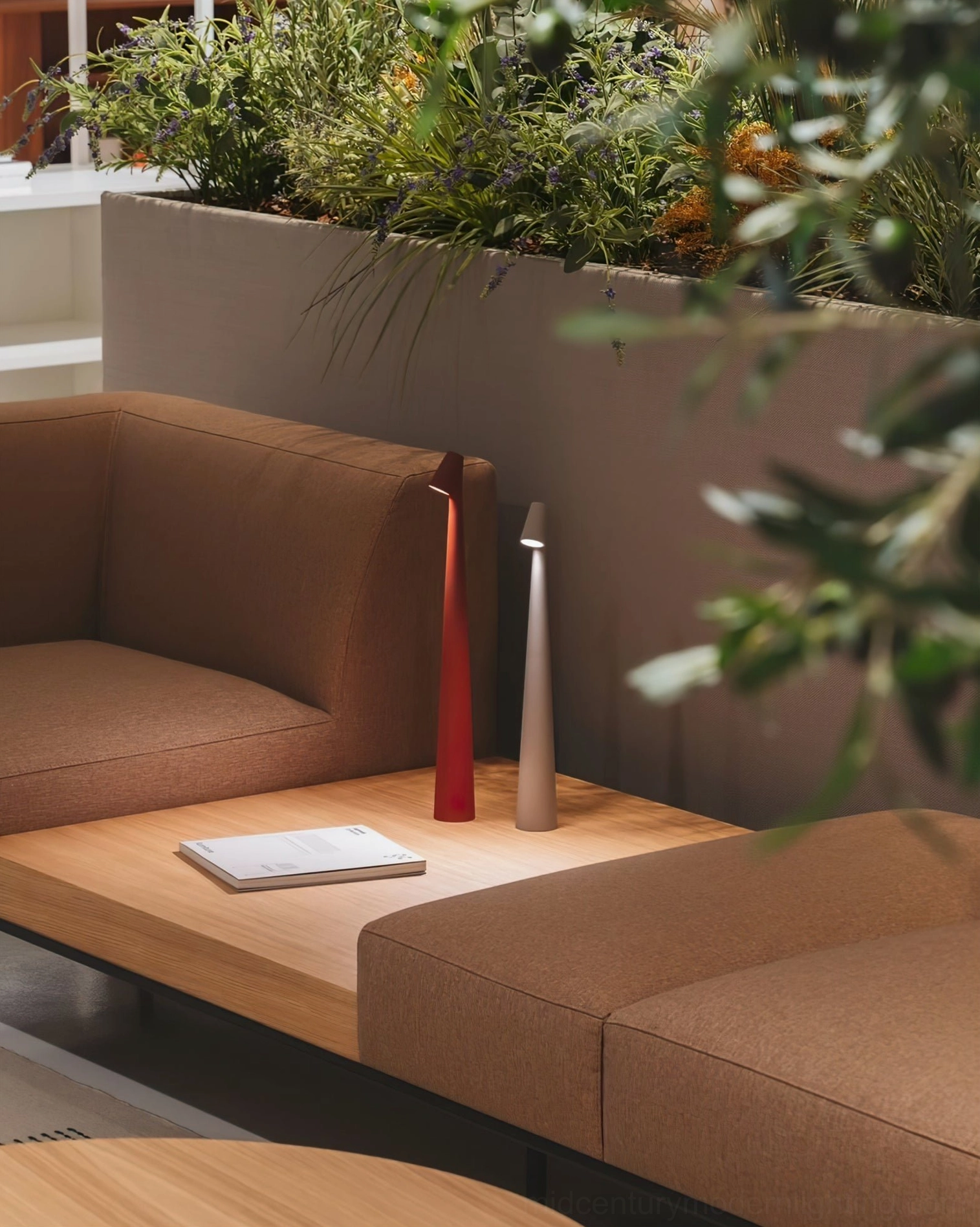 Two Africa portable table lamps with dual finishes on modern coffee table with plant