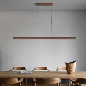 Mid-century modern Aimee Cloud Chandelier suspended above minimalist dining table in contemporary interior