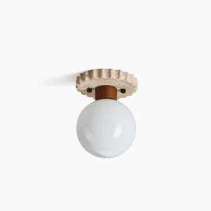 Aisle travertine ceiling lamp with frosted glass globe, side profile view showcasing organic stone texture and minimalist spherical design