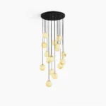 Alabaster ball cluster chandelier with black ceiling mount on white studio background