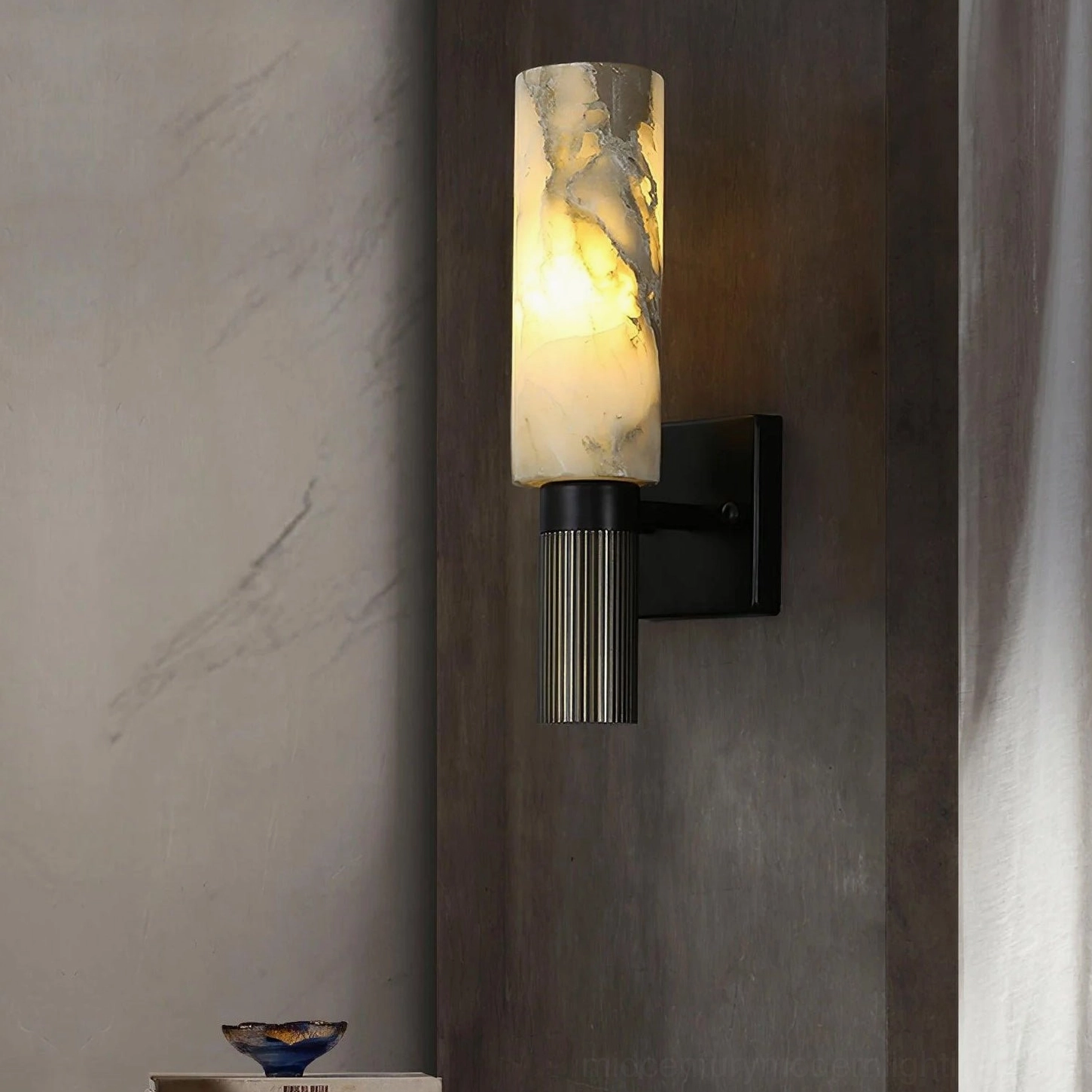 Front-facing alabaster cylinder wall lamp showcasing complete design composition and natural stone character