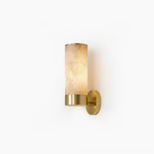 Alabaster cylinder wall sconce with brass collar and round canopy, front view on white background showing natural stone texture and warm illumination