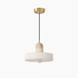 Alabaster disc pendant lamp with brass hardware, overhead studio view showcasing natural stone veining and minimalist modern design