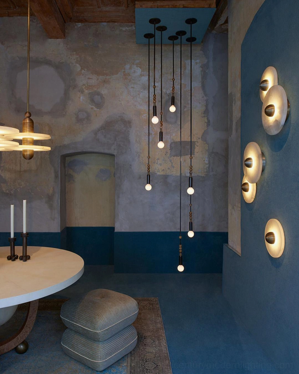 Bathroom vanity with pair of compact alabaster wall lights, mirror framing, warm spa-like ambience