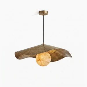 Sylvune alabaster pendant light with hand-hammered brass shade and white stone globe, studio front view on white background