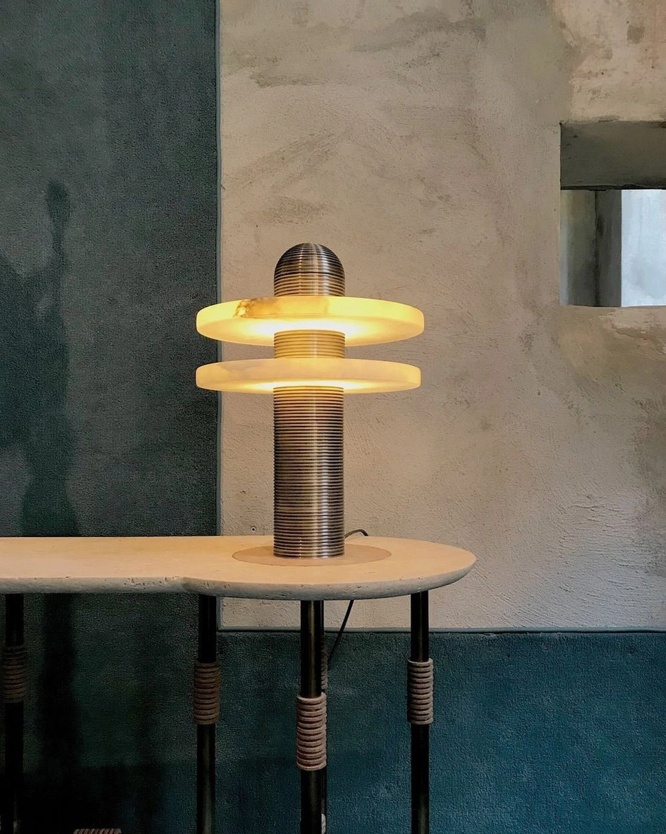 Alabaster Planes Table Lamp geometric alabaster planes intersecting with fluted metal frame, artistic lighting detail