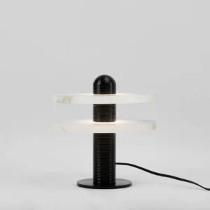 Modern sculptural Alabaster Planes Table Lamp low angle view showing alabaster stone texture and black metal armature