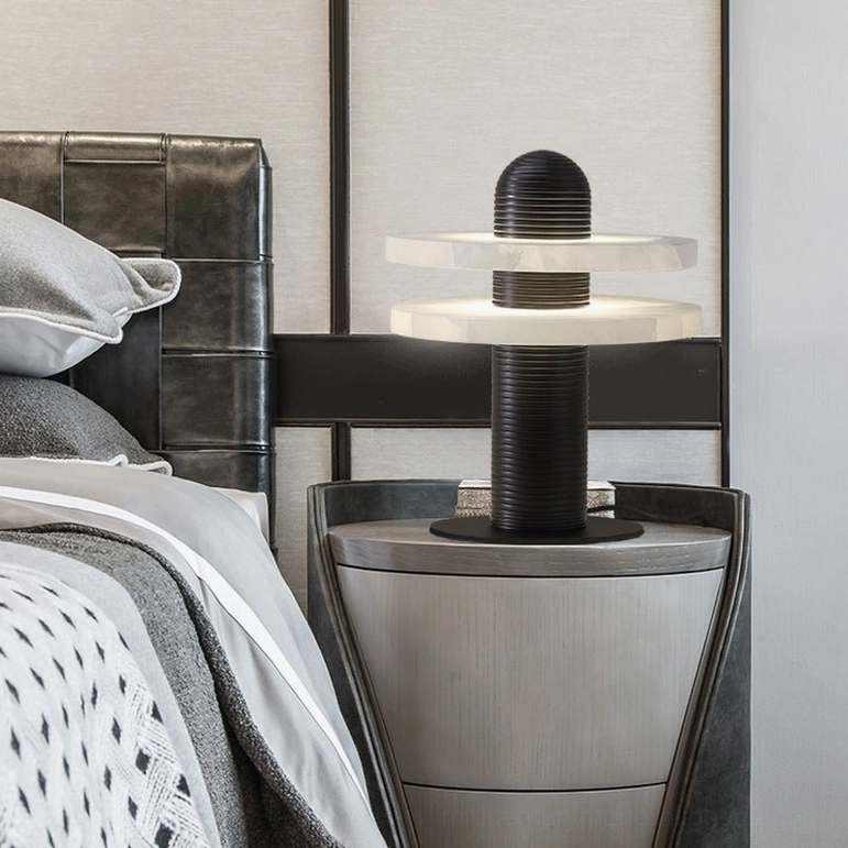 Black and white Alabaster Planes Table Lamp three-quarter angle on silver metal nightstand in minimalist bedroom