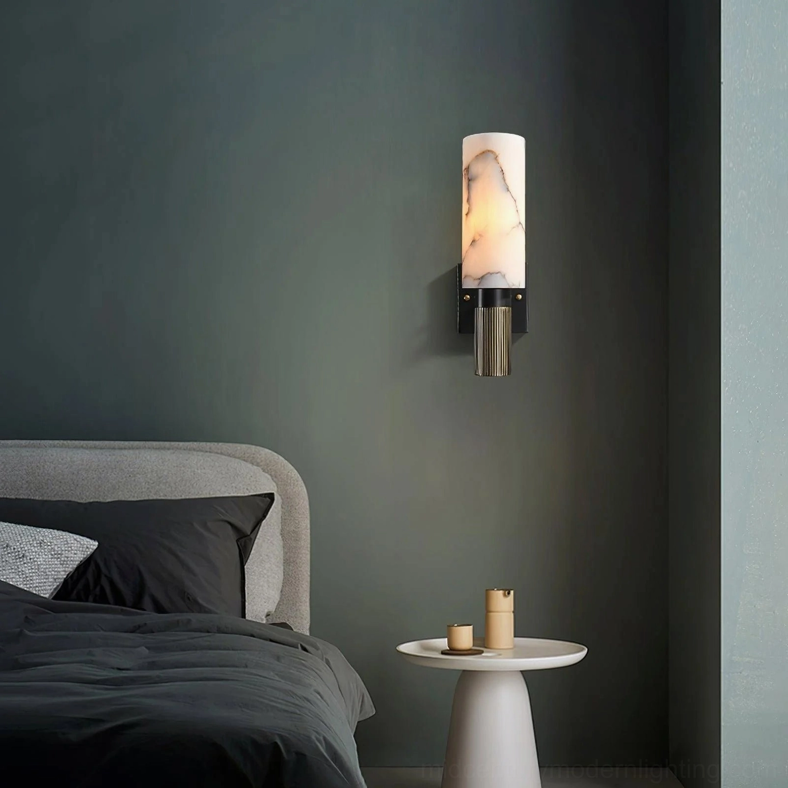 Alabaster wall sconce installation detail showing matte black hardware and brass mounting system precision