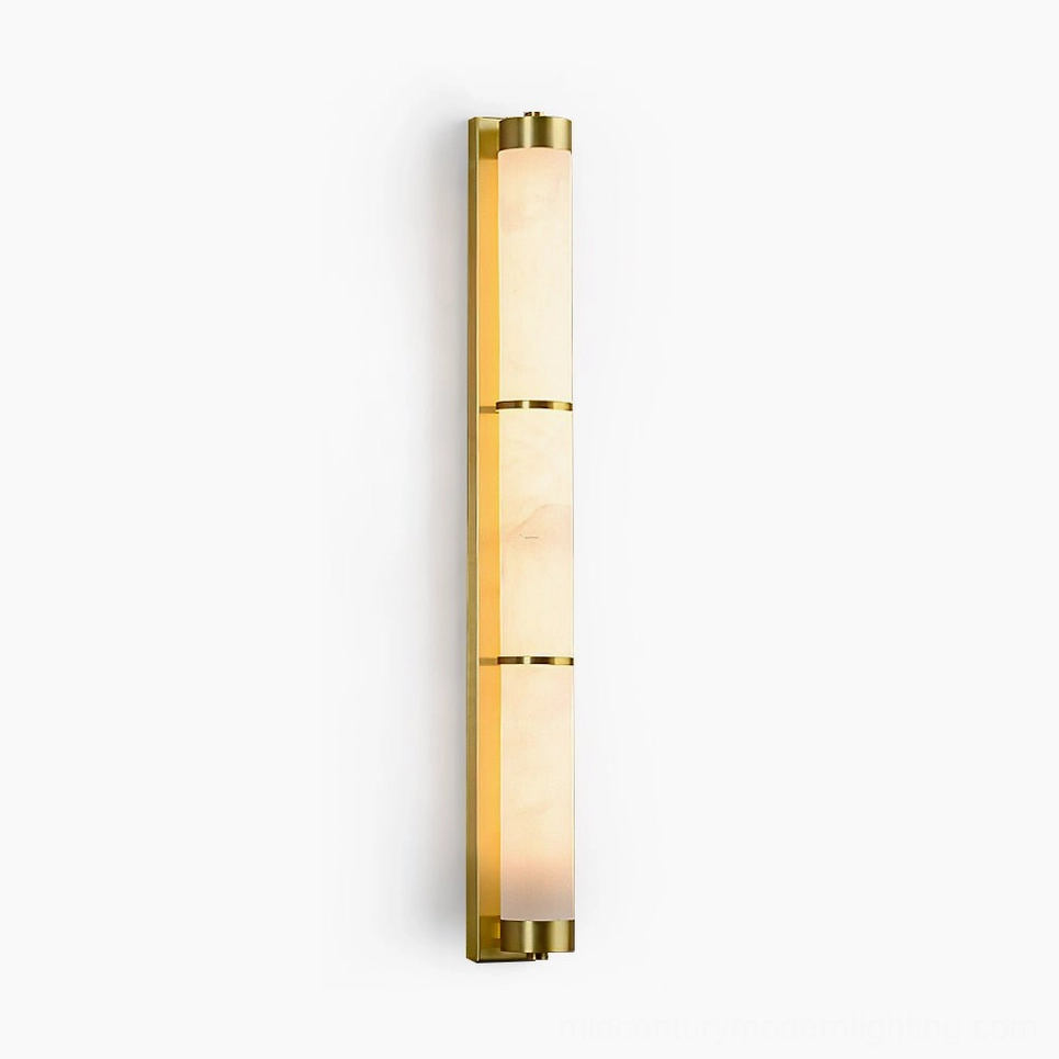 Alabaster cylindrical wall sconce with brass segmented bands, front studio view with pure white background