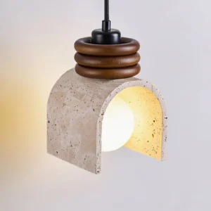 Alagusmo mid-century modern pendant light three-quarter view with warm Edison bulb illuminated and walnut wood rings