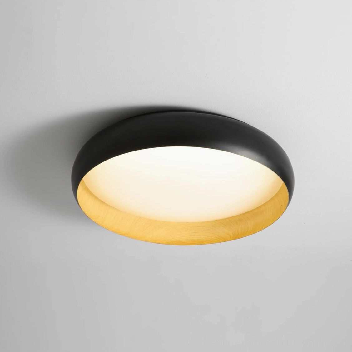 Alamus black round flush ceiling light with soft warm diffused light and wood-grain frame closeup