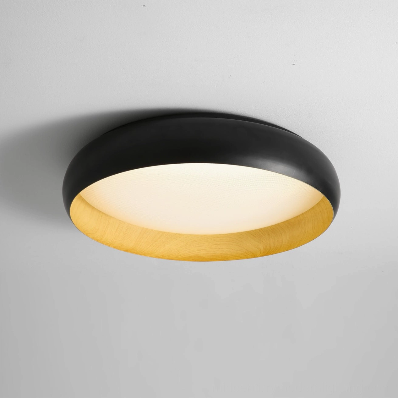 Alamus black round flush ceiling light front detail view with wood-grain inner base on gray background