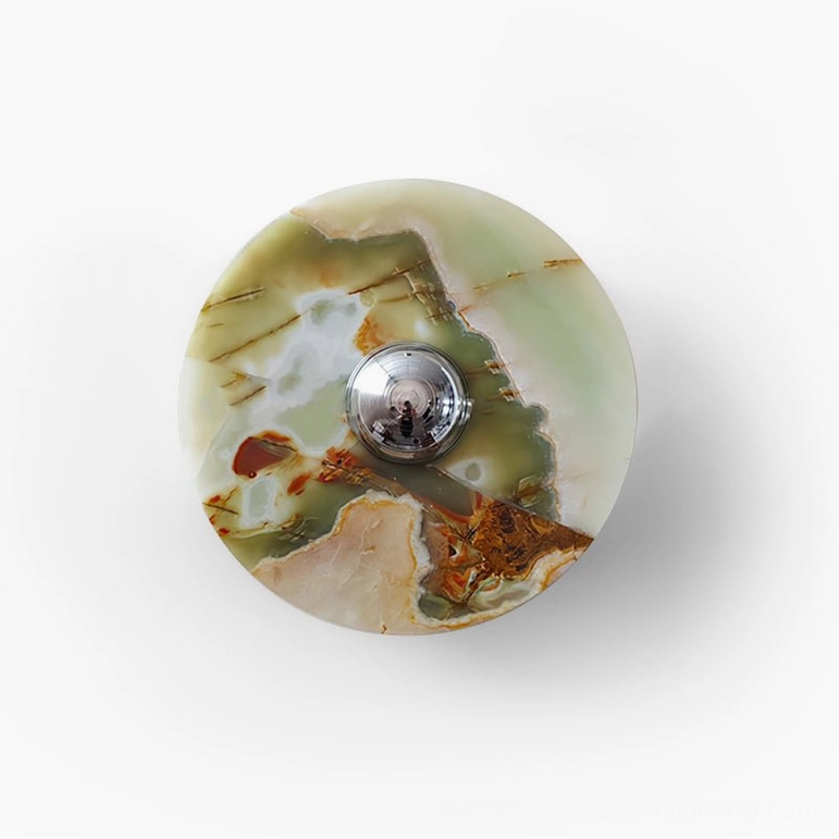 Alba green marble wall sconce minimalist overhead view on white background showcasing clean geometric form and natural stone aesthetic