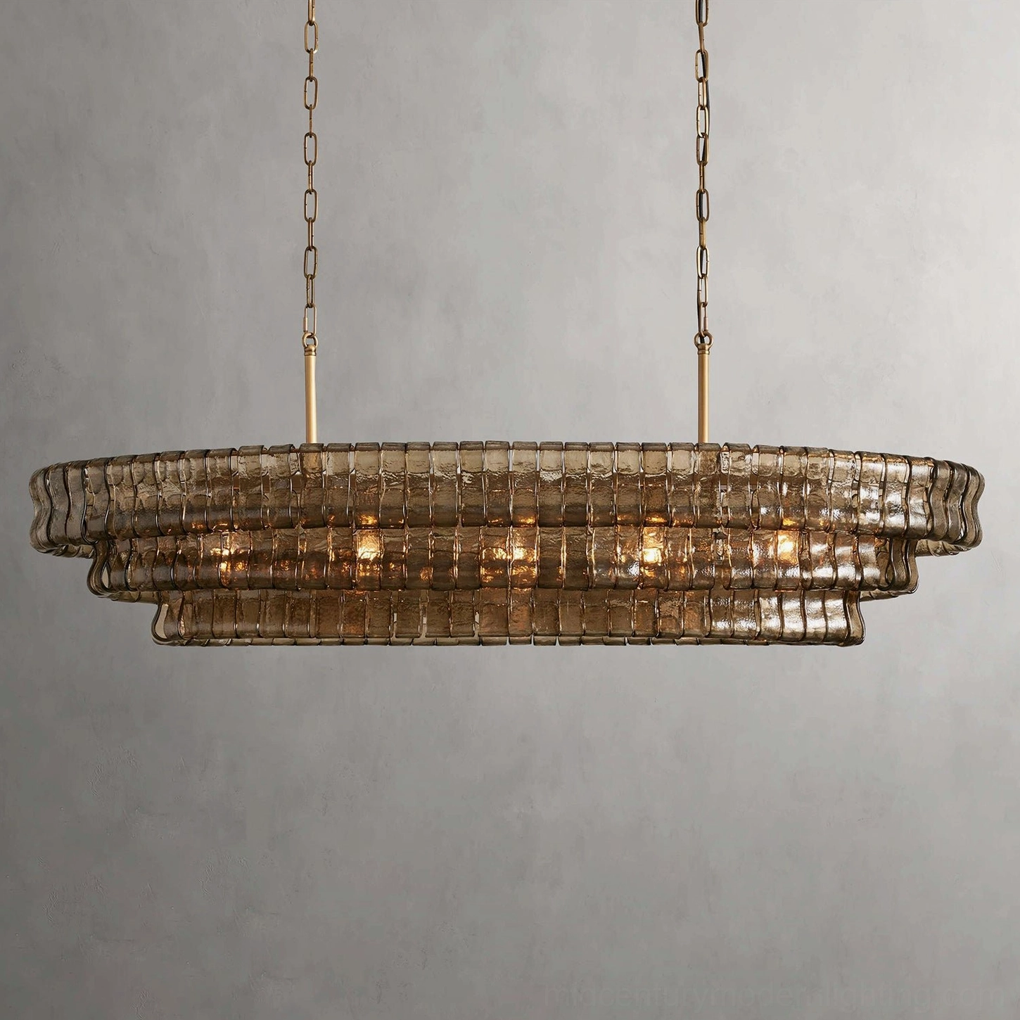 Albano glass chandelier in smoky brown finish, frontal studio view with gray background, showcasing hand-assembled tiered louver construction