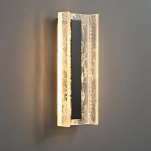 Close-up detail of Alberta LED wall sconce showing warm integrated light glow through marble-textured acrylic
