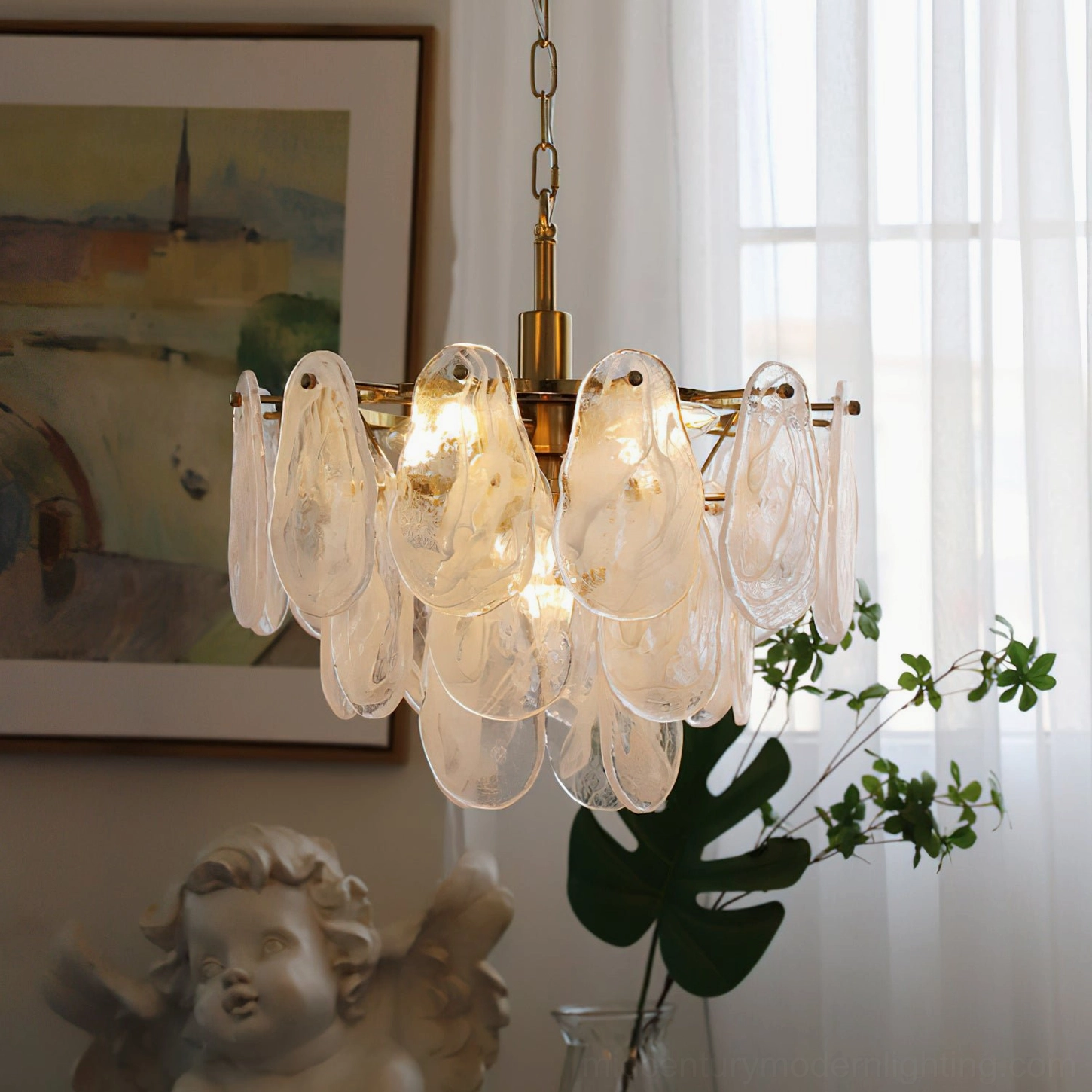 Alessia Glass Chandelier illuminated eye-level view, visible warm bulbs inside, textured glass pendants