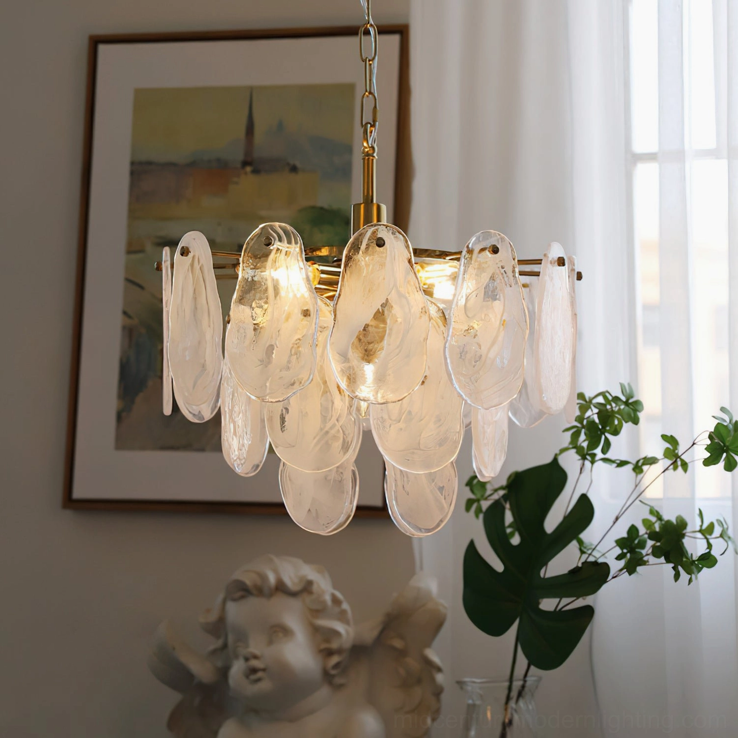 Alessia Glass Chandelier unlit window display, clear textured teardrop glass, brass metal frame detail