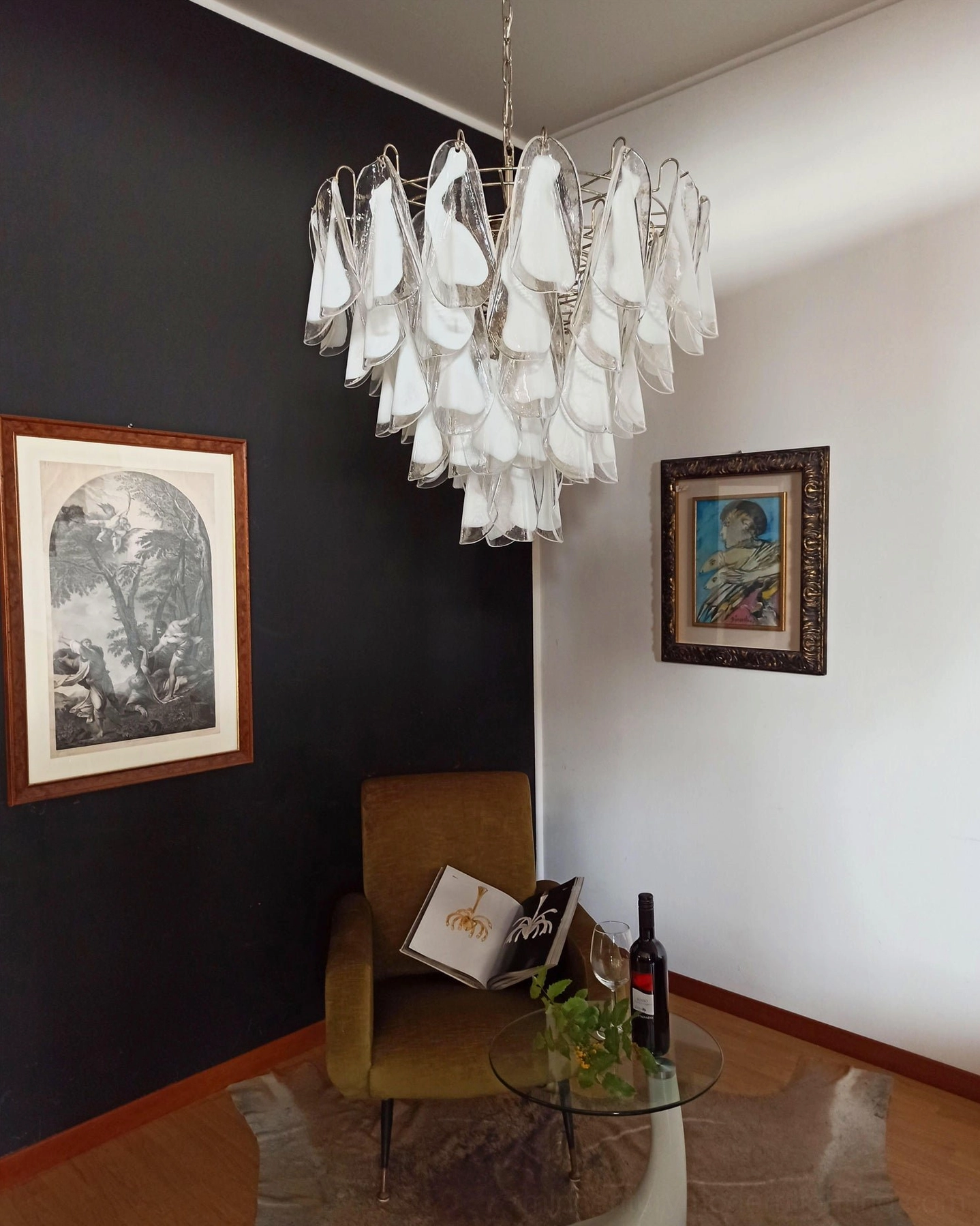 Aletta petal chandelier illuminated warm lighting ambient glow dark accent wall