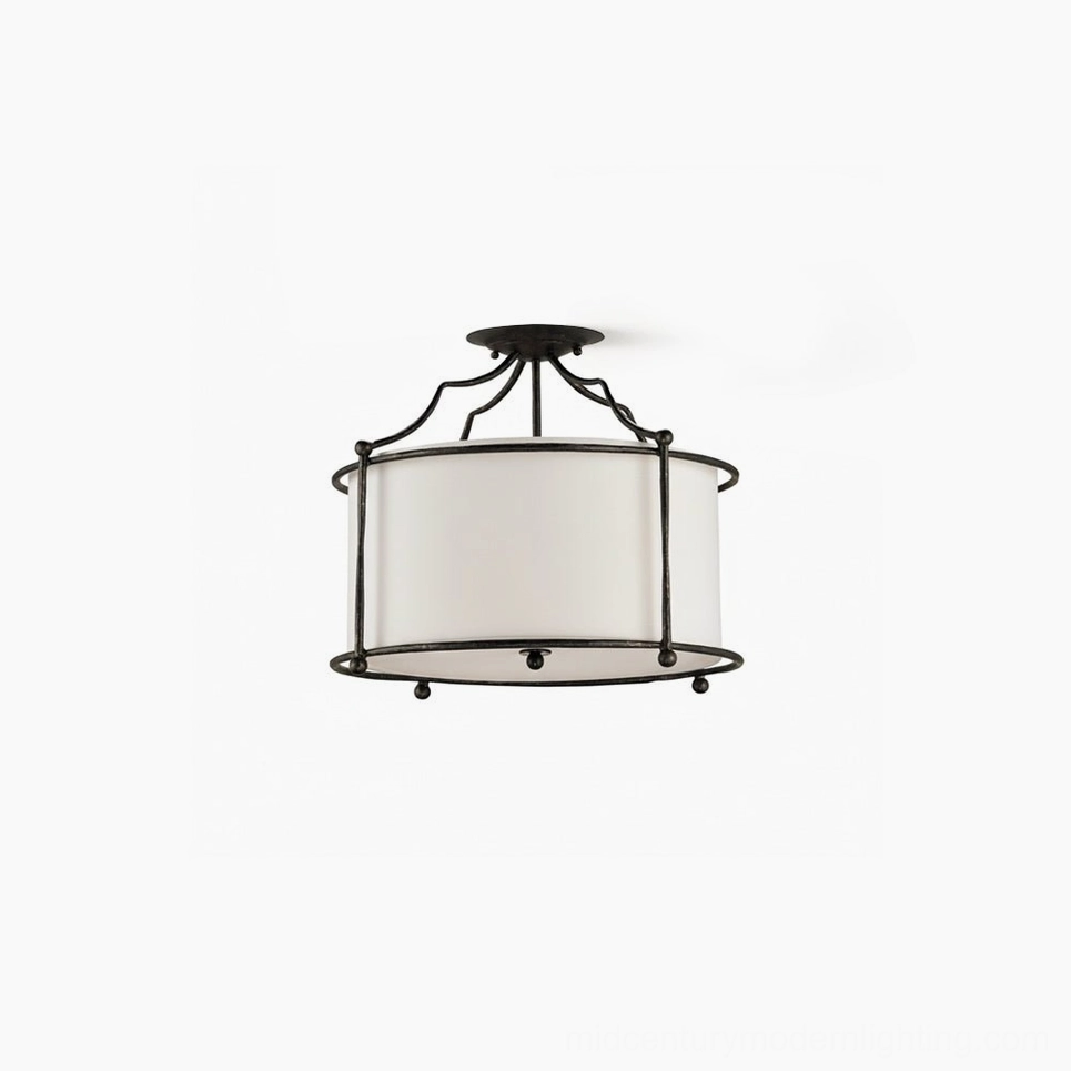 Alexa semi-flush ceiling lamp front view with black wrought brass frame and white fabric drum shade on white studio background