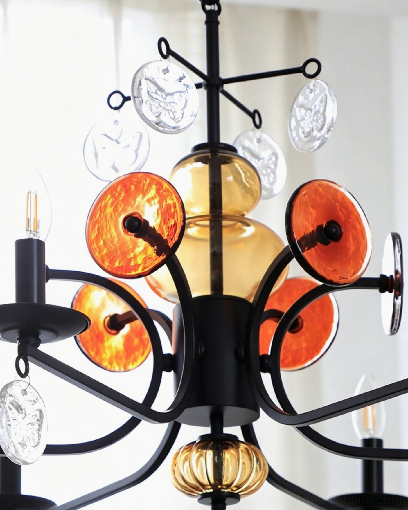 Alistair candle chandelier six-light fixture in contemporary interior showcasing sculptural iron and glass elements