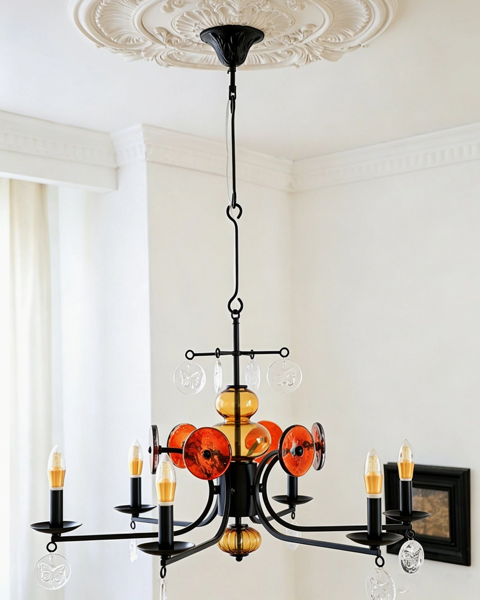 Alistair amber glass candle chandelier showing full six-light configuration and sculptural iron frame design