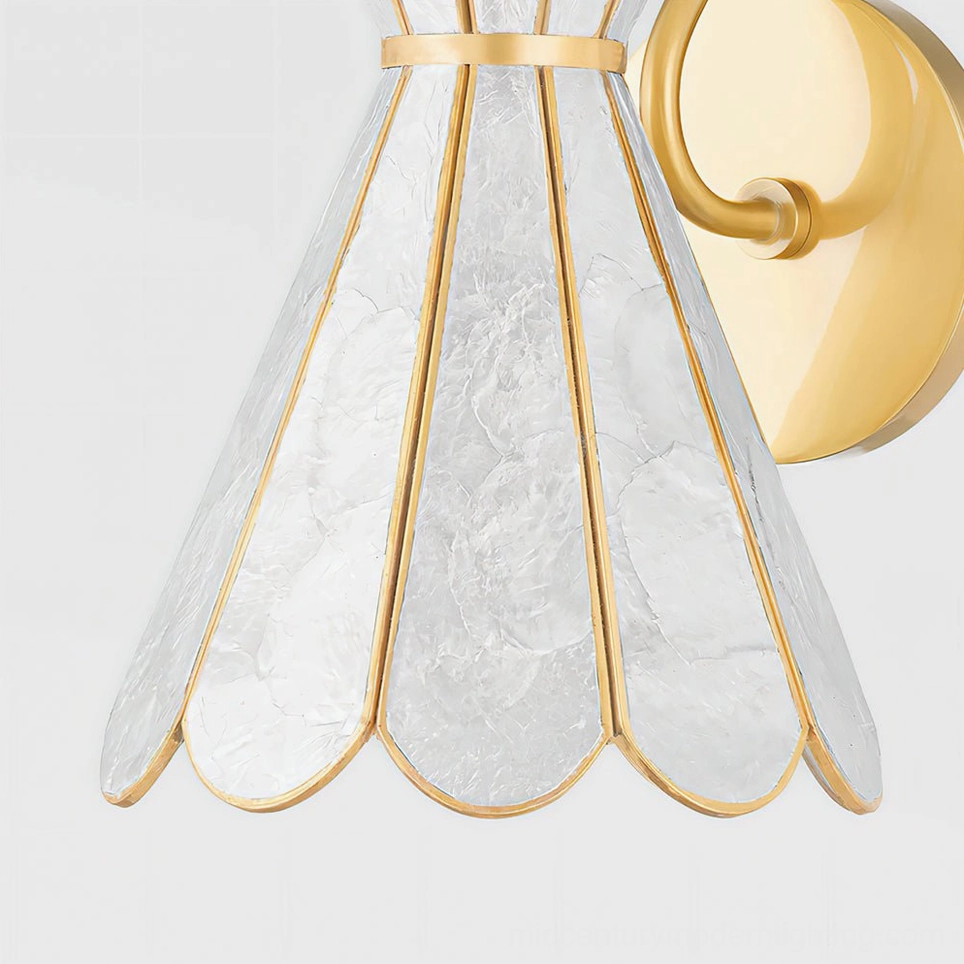 Alito wall lamp shade detail close-up showing translucent frosted natural shell with brass petal trim finish