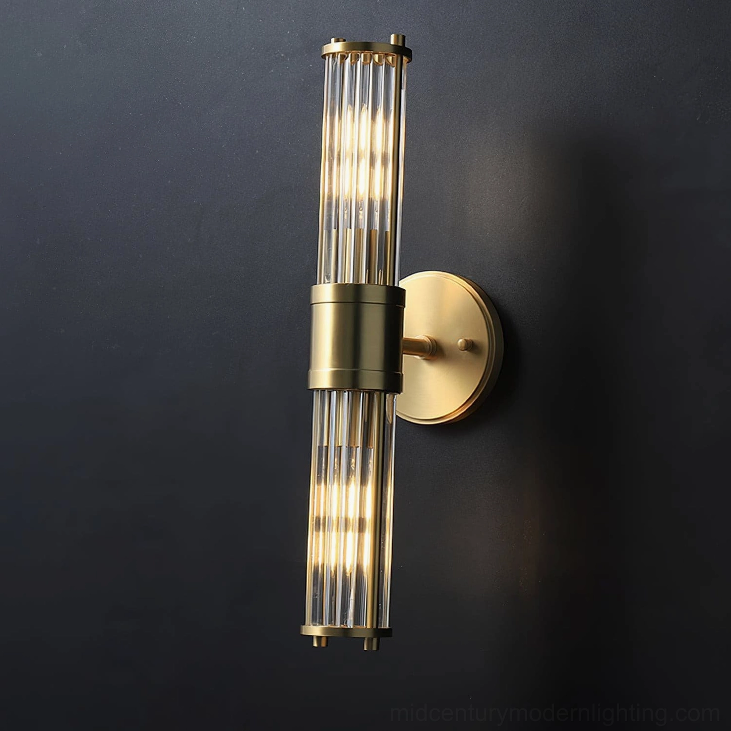 Allen brass sconce installed flanking bathroom vanity mirror with task lighting effect