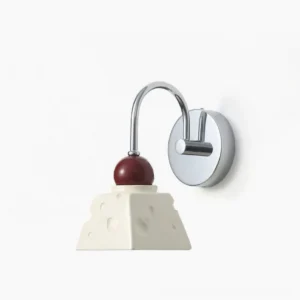 Alma modern wall sconce in chrome and red finish, front view showing sculptural resin diffuser design