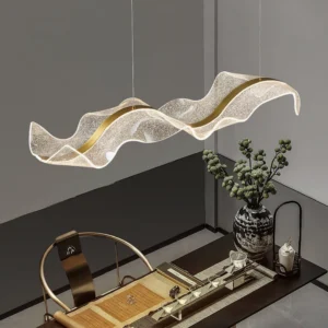 Lit Alon pendant light casting warm glow in contemporary study room with decorative plants and modern furnishings