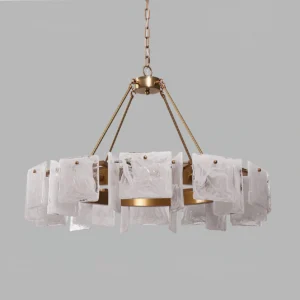 Overhead close-up detail of Alsona chandelier showing marbled white glass shades and brushed brass hardware joints