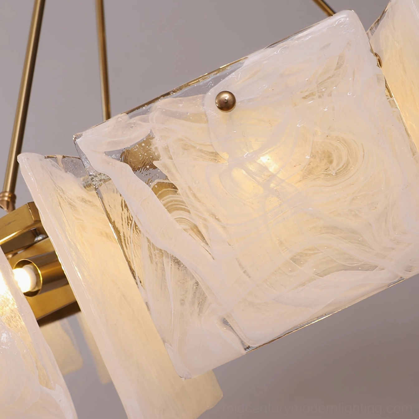 Macro close-up of individual marbled white textured glass shade from Alsona chandelier, showing artisanal glass craftsmanship