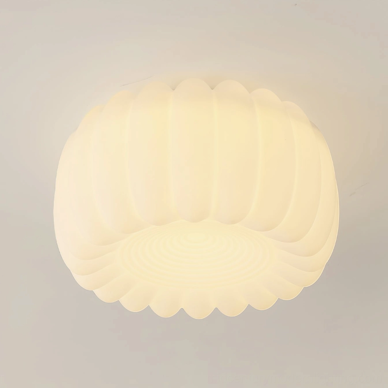 Close-up detail of Alta ceiling lamp warm white glow and textured scalloped edge design