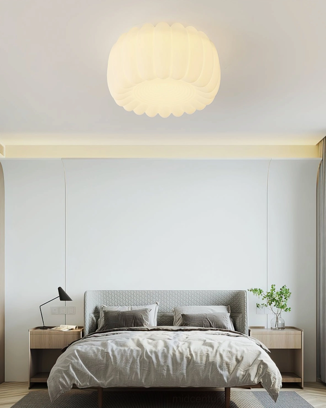 Alta flush mount light in modern bedroom with gray bedding and contemporary minimalist design