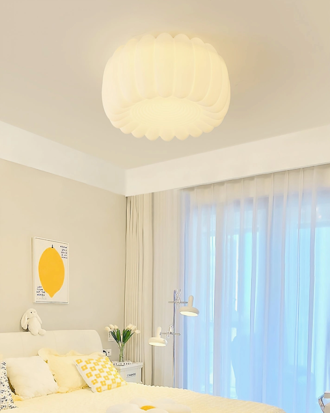 Alta pumpkin ceiling lamp overhead view in bright bedroom with yellow accent wall and warm lighting